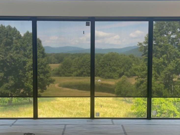 Hunter Douglas Motorized Shades in a Living Area